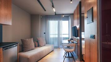 Classic Double Room | Living area | Flat-screen TV
