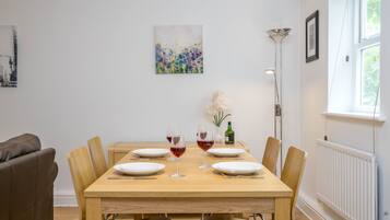 Apartment, 2 Bedrooms | Living area | 24-inch TV with cable channels