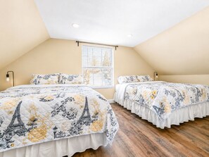 A bedroom with two beds, a window with blinds, and a wooden floor. - Jaybird Lodge - Walk to Lake & Village, Fireplace, AC (Big Bear Lake)