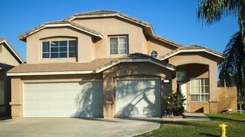 House exterior with large driveway to park cars