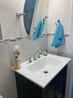 Bathtub, hair dryer, towels, soap