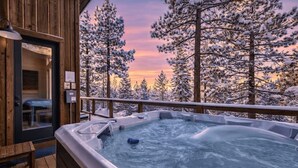 A hot tub on a wooden deck with a view of snow-covered trees. - PeakViewTahoe: Hot Tub, AC, Game Room, ProjectorTV (South Lake Tahoe)