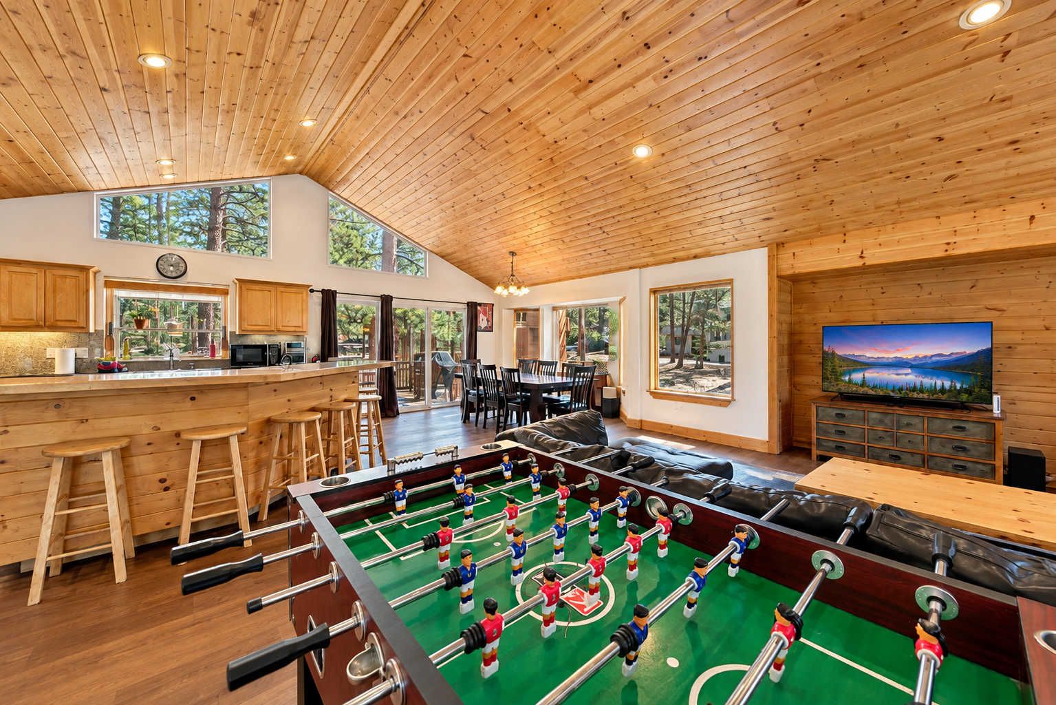 Pool table and foosball table create a dedicated space for friendly competition, while Nintendo Wii, 5 Smart TVs and YouTube TV give the whole group plenty of entertainment options.