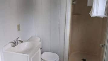 Bathtub, hair dryer, towels, soap