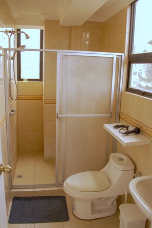 Shower, hair dryer, towels, shampoo