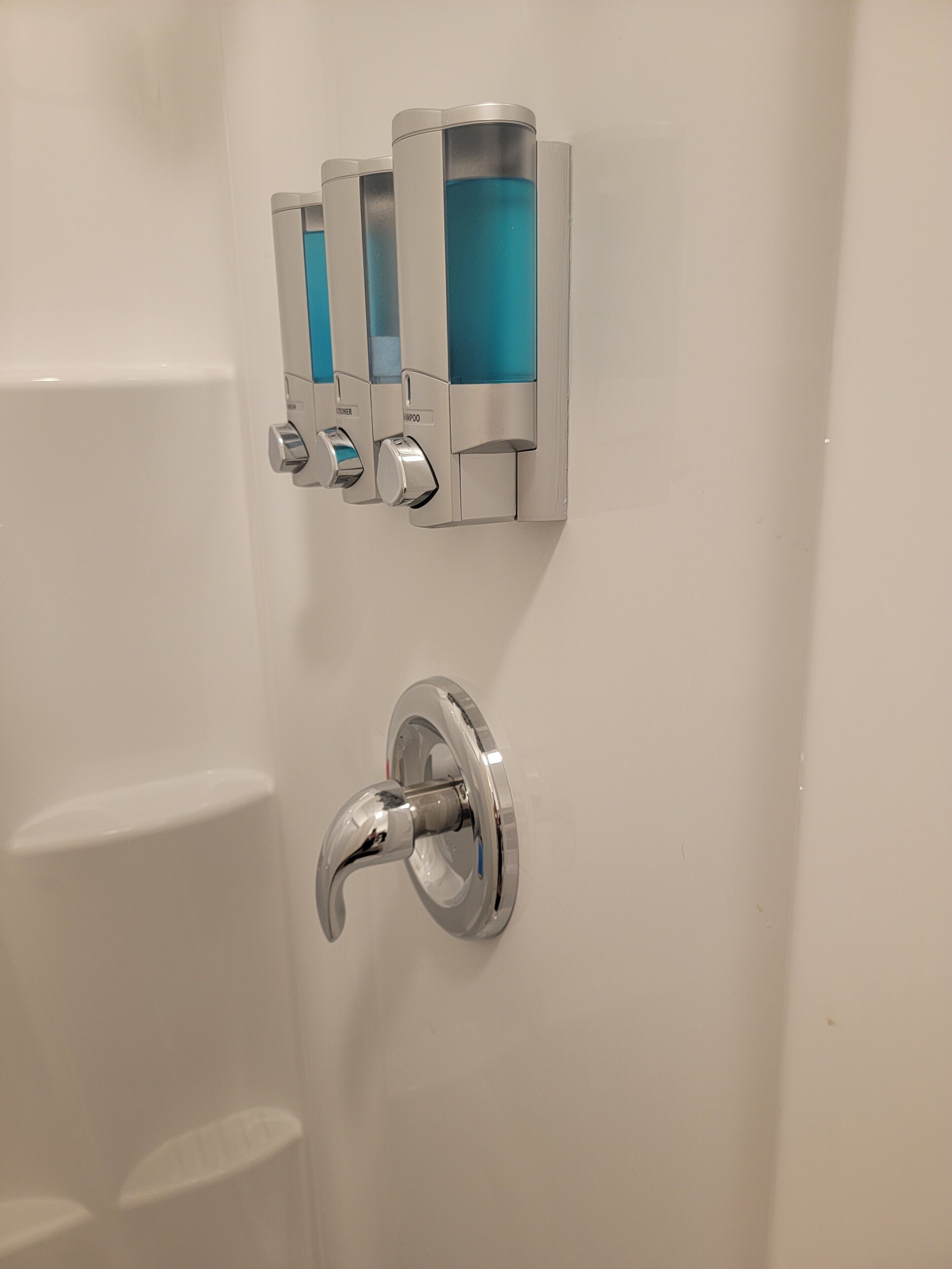 Shower, hair dryer, soap, toilet paper