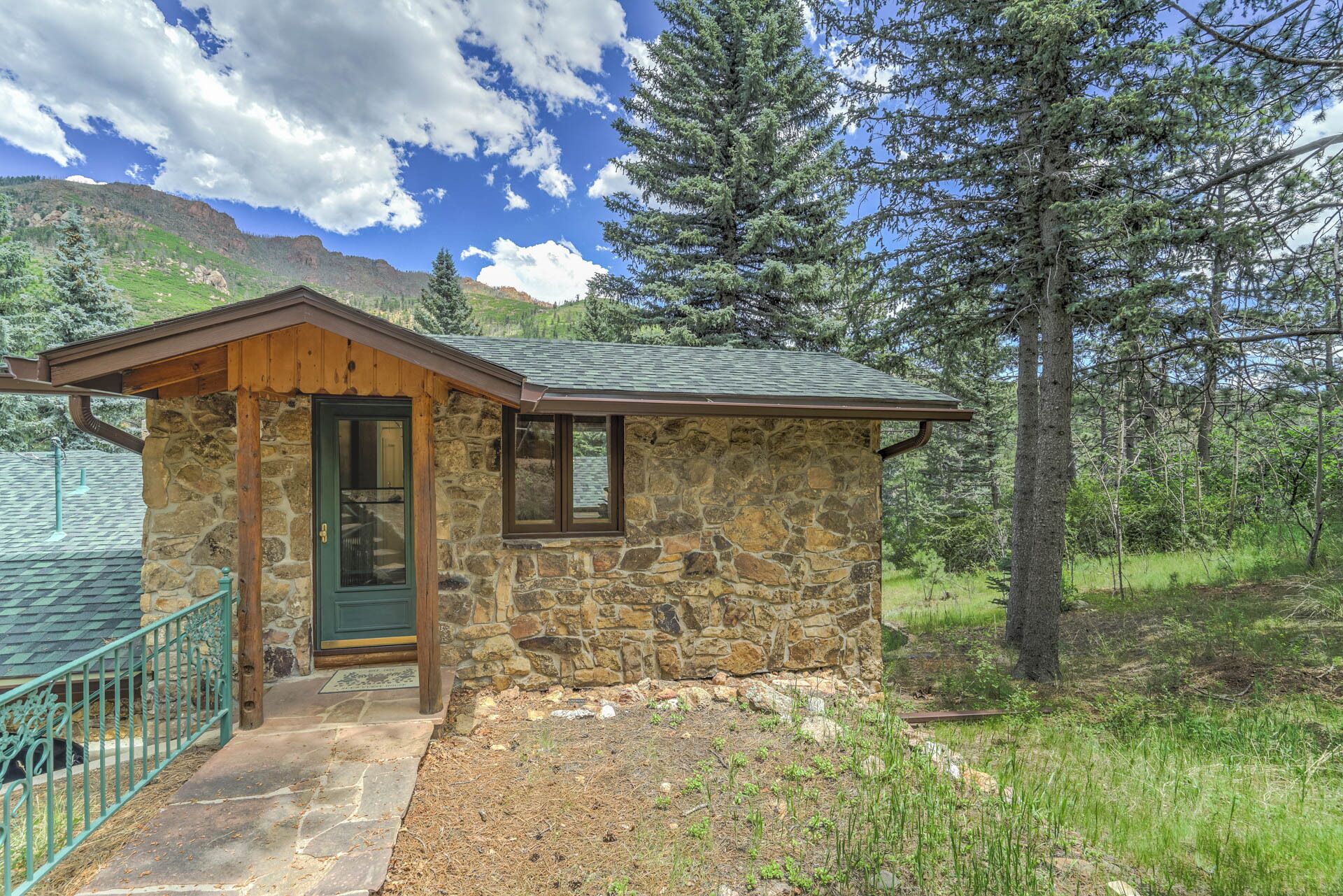 Pikes Peak Stone Cottage | Hot Tub & Game Room