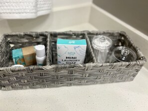 Combined shower/bathtub, towels, soap, toilet paper