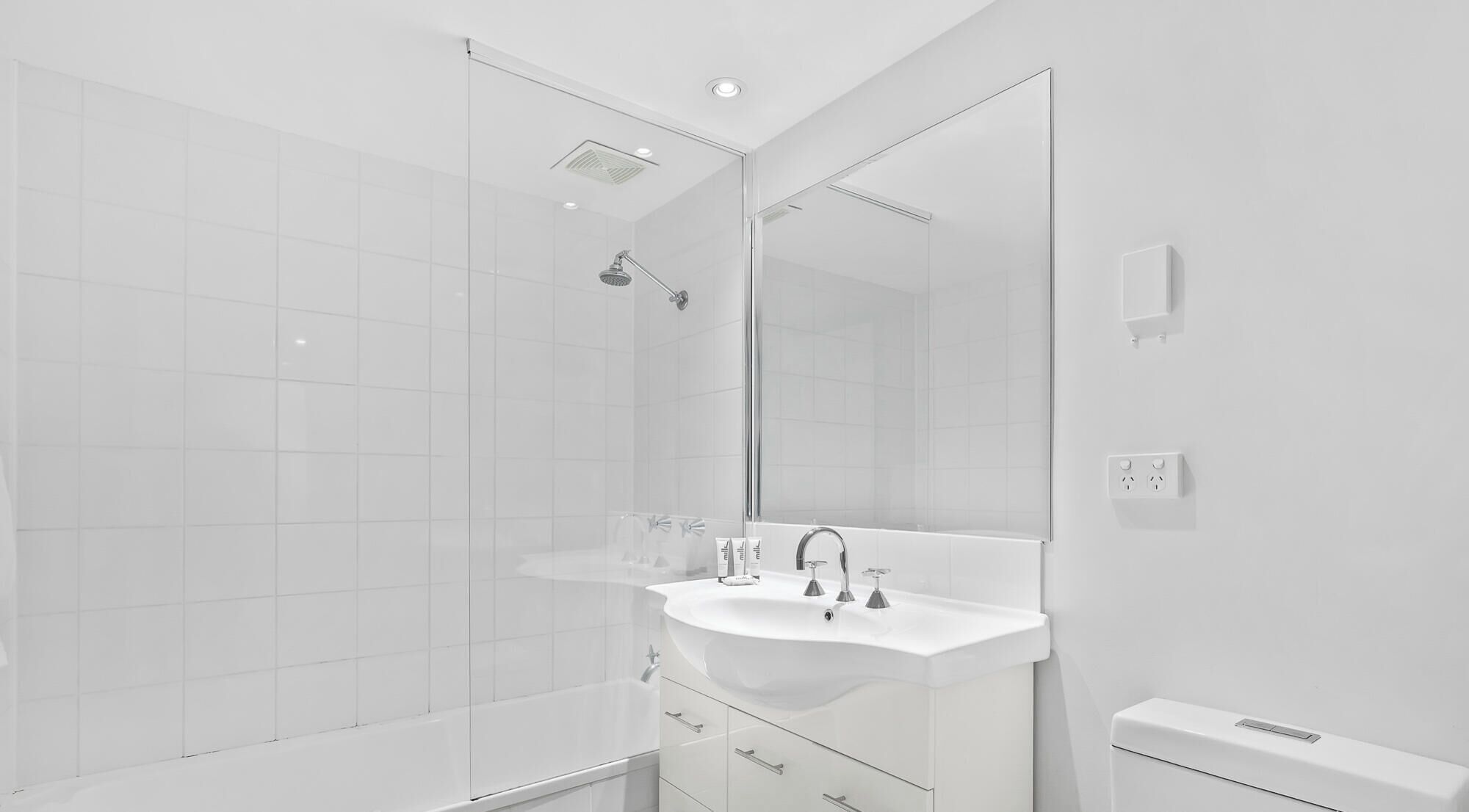 Combined shower/bathtub, hair dryer, towels, soap