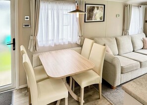 Dining - 12ft-wide luxury caravan with one double with en suite shower and one twin. (Nr New Quay, Cardiganshire)