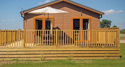 Luxury lodge with one double with freestanding bath.