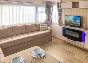 TV - Spacious 12ft-wide caravan with one double and one twin. (Chapel St Leonards, Skegness)