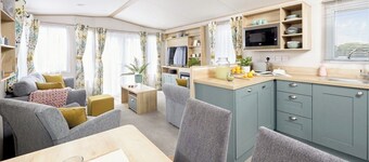 Stylish and modern 12ft-wide caravan with one double two one twin.