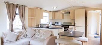 Stylish and modern 12ft-wide caravan with one double two one twin.