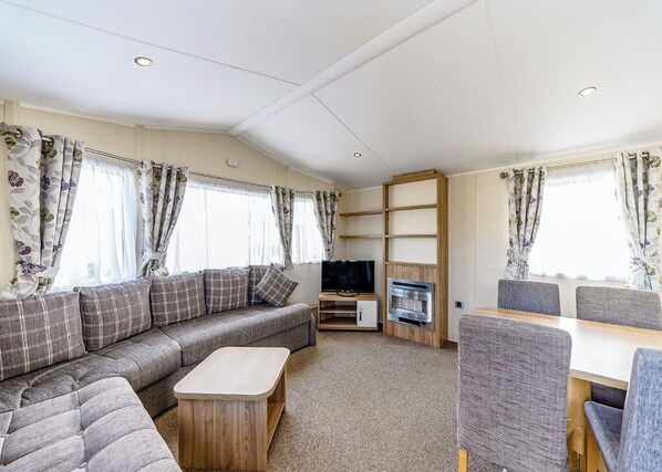 Living area - Modern and contemporary 12ft-wide caravan with two twin. (Bleadon, Weston-Super-Mare)