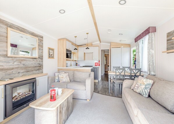 Living area - Spacious and luxurious 12ft-wide caravan with one double and two twin bedrooms. (Axminster)
