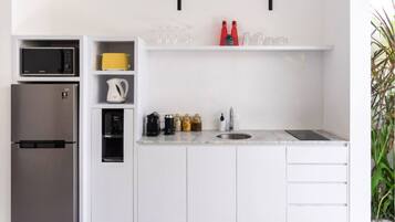 Full-sized fridge, microwave, stovetop, electric kettle