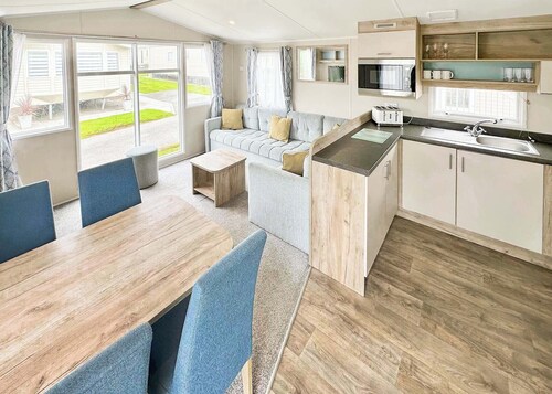 Contemporary 12ft-wide caravan with one double and one twin.