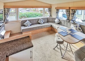 Living area - Well presented 12ft-wide caravan with one double and one twin. (Clunderwen, Nr Narberth)