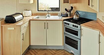 Spacious and comfortable 12ft-wide caravan with one double and two twin.