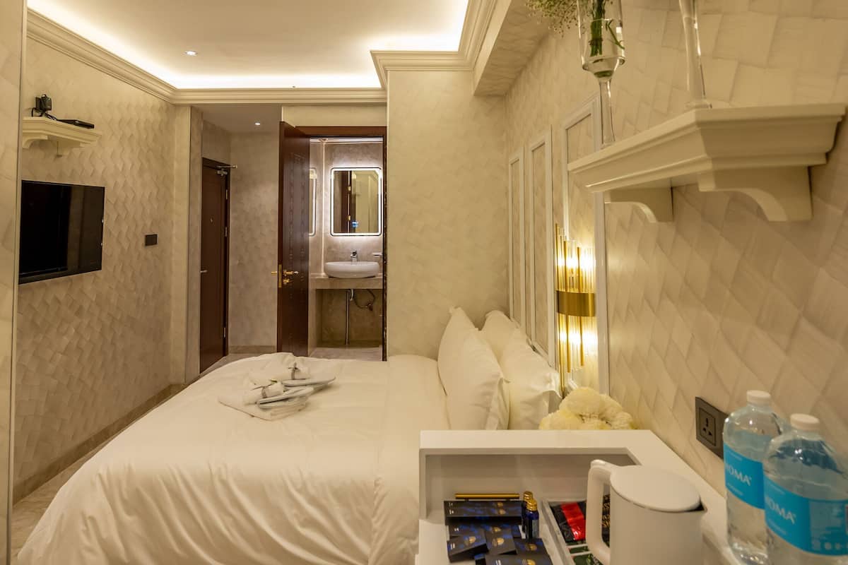 Premium bedding, desk, laptop workspace, soundproofing