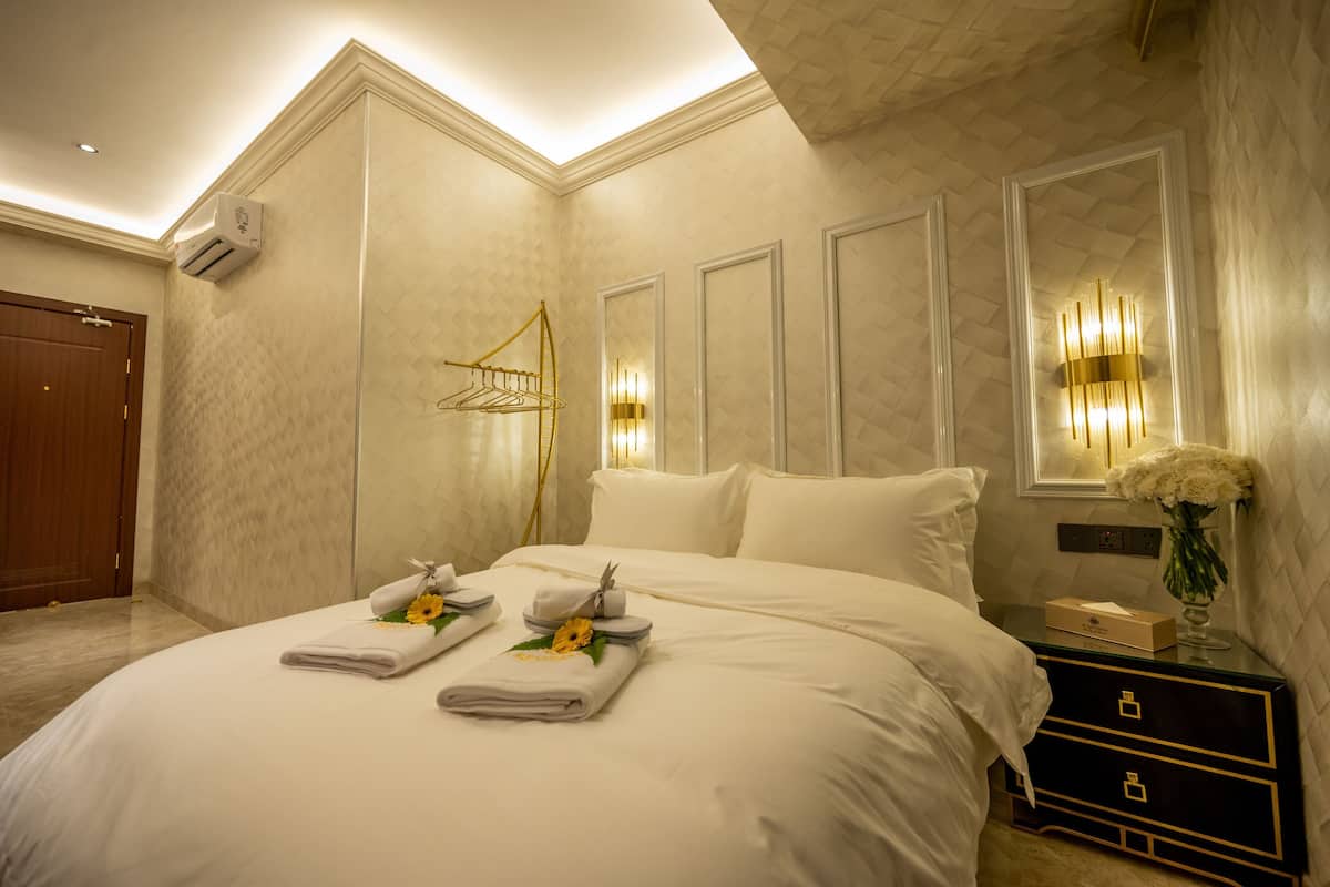 Premium bedding, desk, laptop workspace, soundproofing