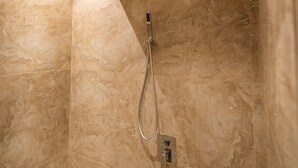 A shower with a handheld showerhead and a wall-mounted control panel. - A Residence - A Member of The Luxury Stay Group (Kota Kinabalu)