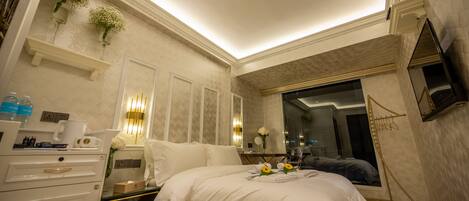Premium bedding, desk, laptop workspace, soundproofing