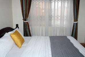 Executive Room | Blackout drapes, free WiFi, bed sheets - Pearl Boutique Hotel (Kampala)
