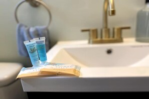 Bathtub, towels, soap, shampoo