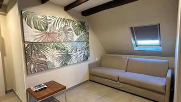 Superior Apartment | Living area | 22-inch flat-screen TV with digital channels, TV