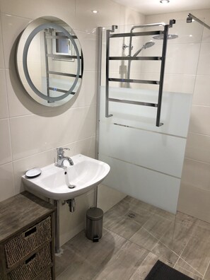 Shower, hair dryer, towels, soap