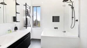 Bathtub, hair dryer, towels