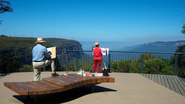 Artists can paint from this scenic overlook with a panoramic view of the surrounding mountains.