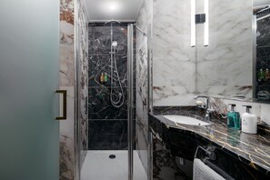 Designer toiletries, hair dryer, bathrobes, slippers