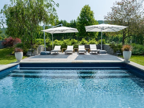 3 bedroom house with a heated pool