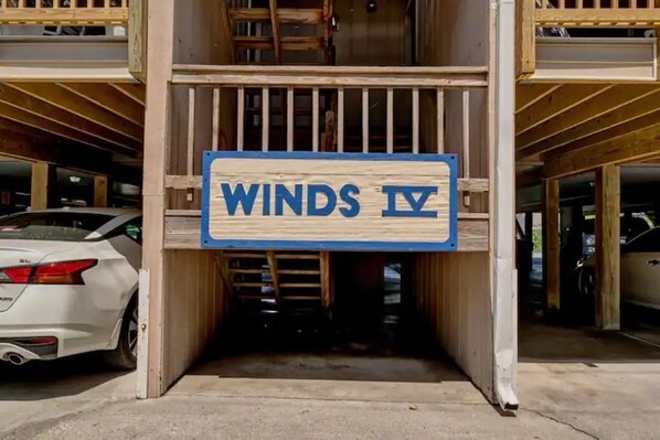 A building entrance with a sign reading "WINDS IV". - Beach Condo in great location,sleeps 6! (Carolina Beach)