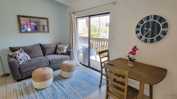 Apartment, Multiple Beds, Pool Access | Living area | 40-inch TV with cable channels