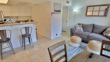 Apartment, Multiple Beds, Pool Access | Living area | 40-inch TV with cable channels