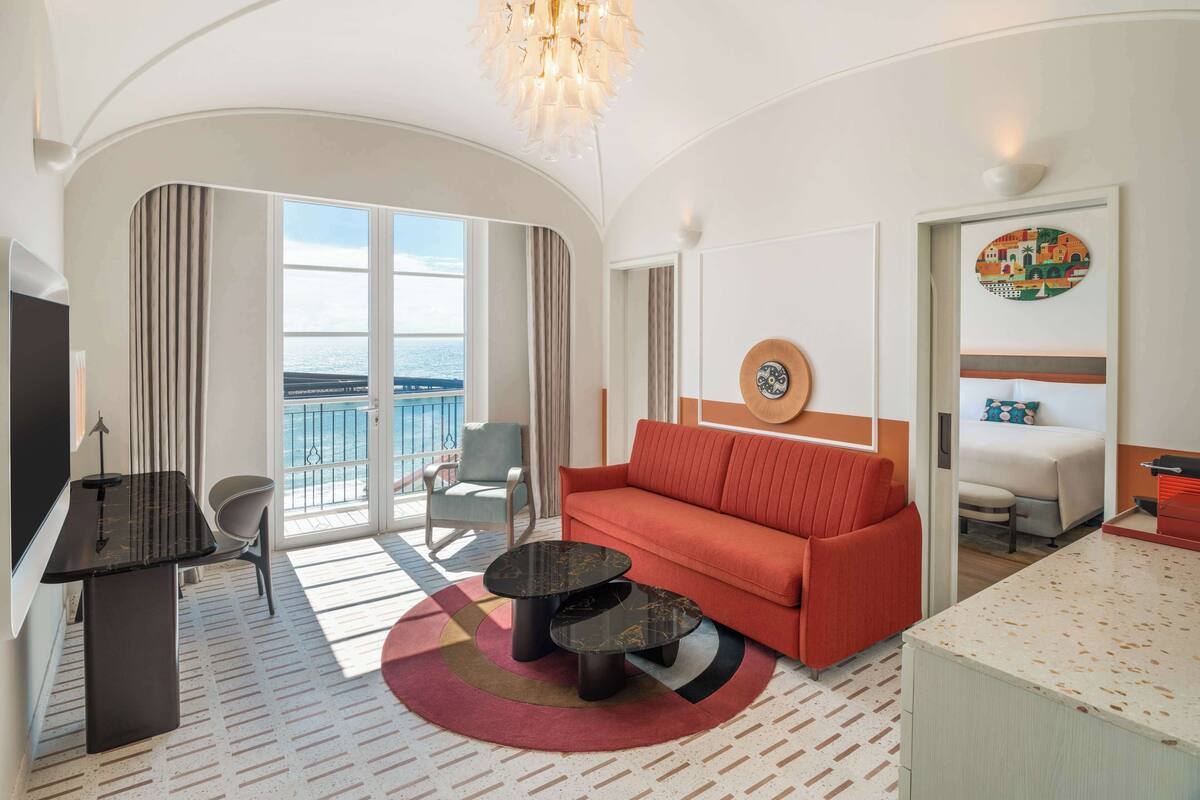 Suite, 1 King Bed, Adjacent Balconies, Bay View | Living area | 55-inch LCD TV with cable channels