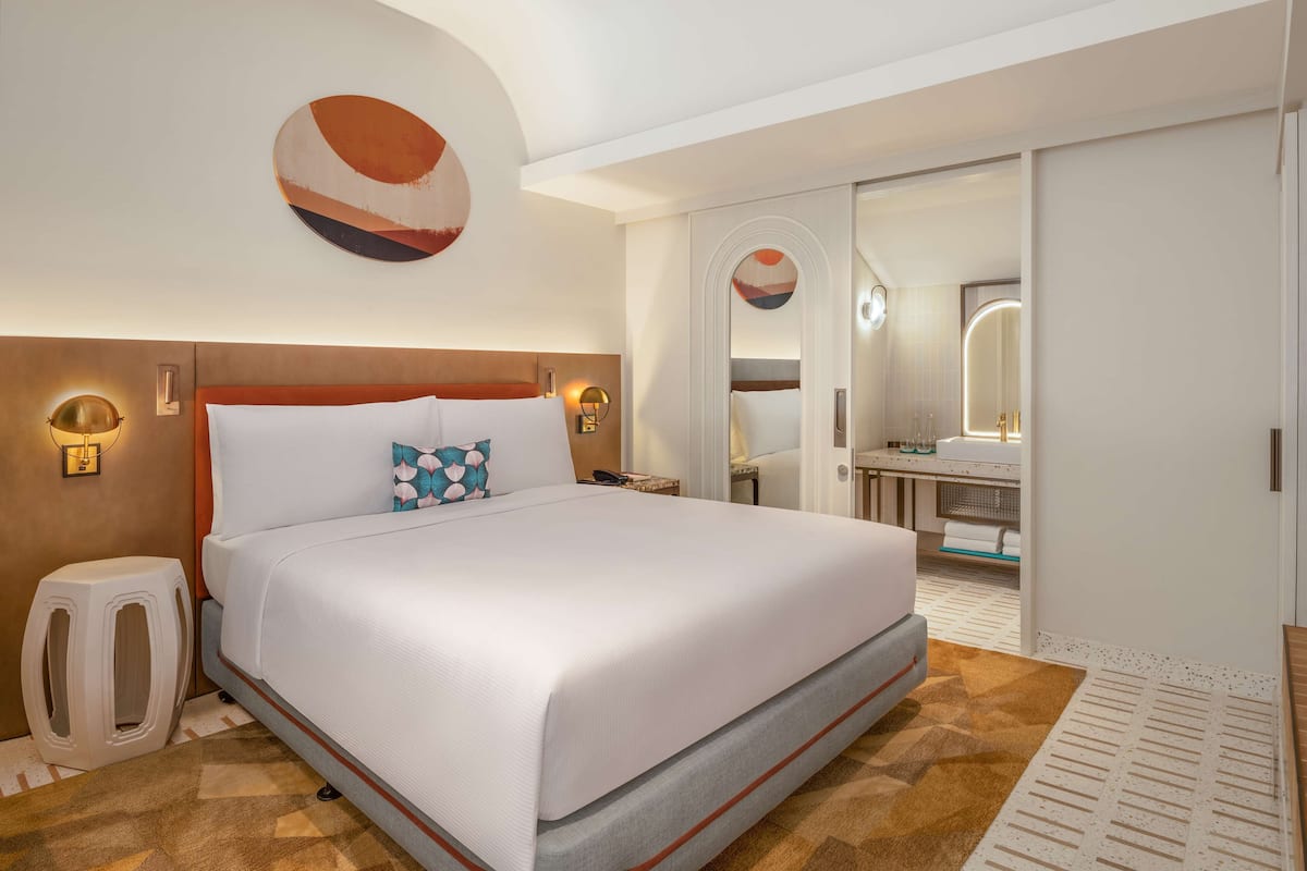 Duplex, 1 King Bed, Balcony, Bay View | In-room safe, desk, laptop workspace, iron/ironing board