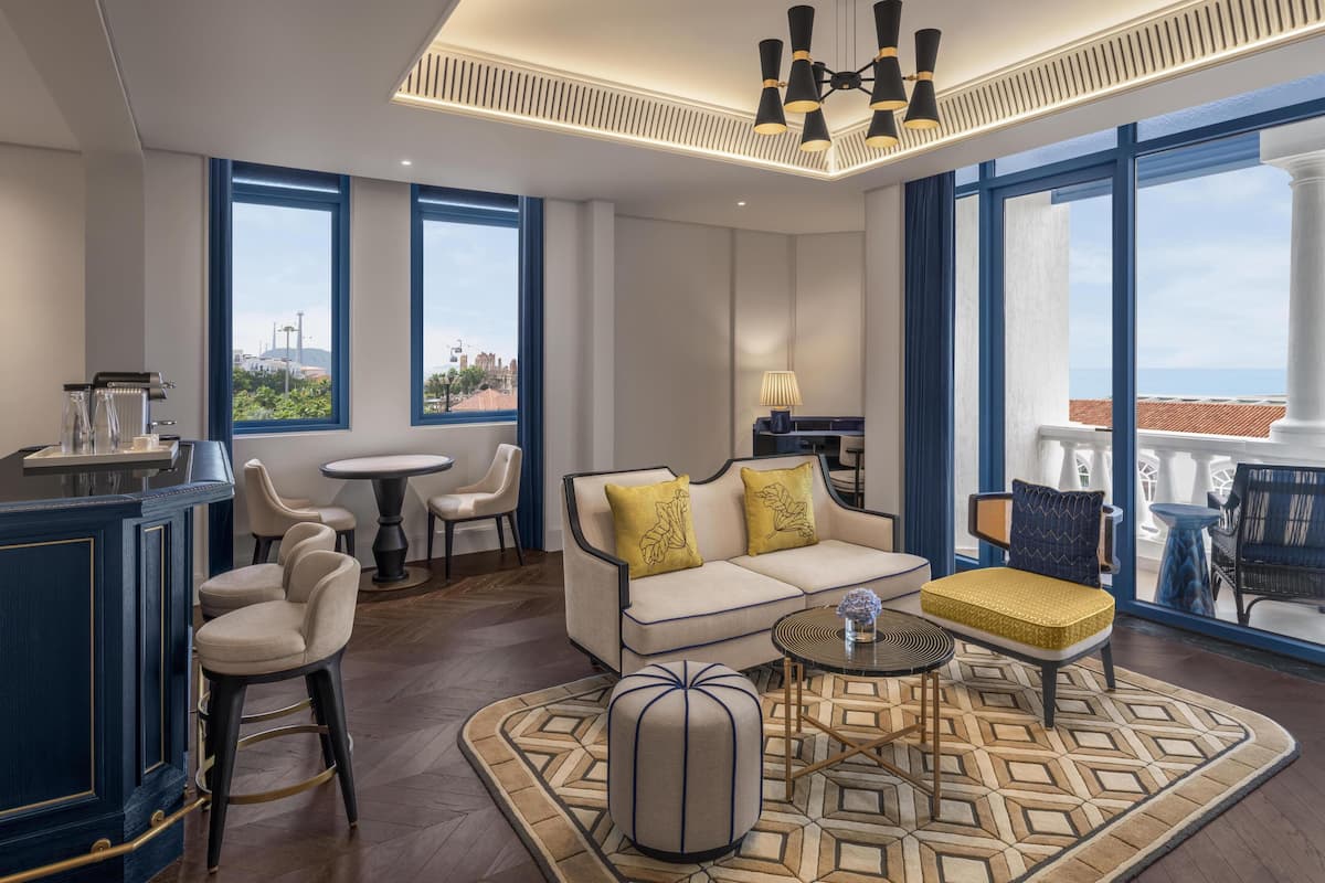 Suite, 1 King Bed, 2 Balconies | Living area | 55-inch LCD TV with cable channels