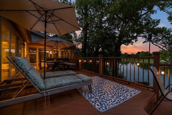 Spacious outdoor deck perfect for dining, lounging, or watching the sunset over the lake.