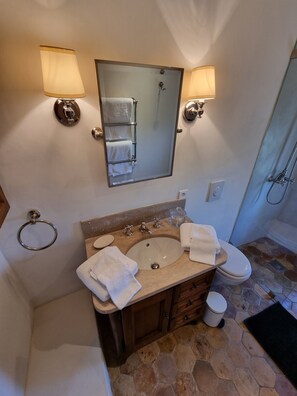 Bathtub, hair dryer, bathrobes, slippers