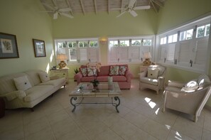 TV, books - The Garden Loft with pool and club house access (Mount Standfast, St. James)