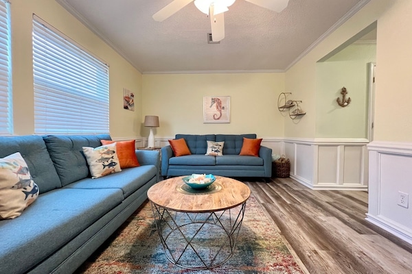 The living room features brand new furniture installed in January, 2023.