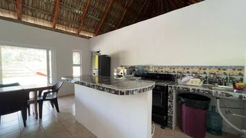 Fridge, oven, stovetop, dining tables