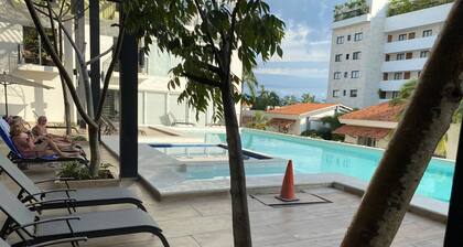 Elegant Studio, one block from the beach, Pool, Gym.