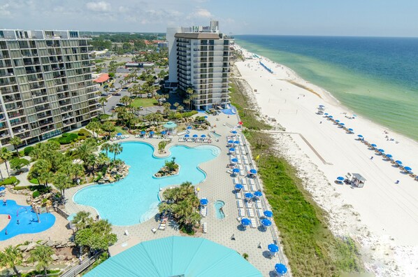 Relax by the ocean with stunning views from your balcony, surrounded by lush landscaping and multiple pools.