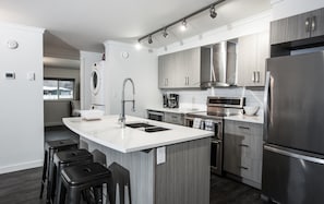 Condo | Private kitchen | Full-sized fridge, microwave, oven, stovetop - Novlan Suite by Revelstoke Vacations (Revelstoke)